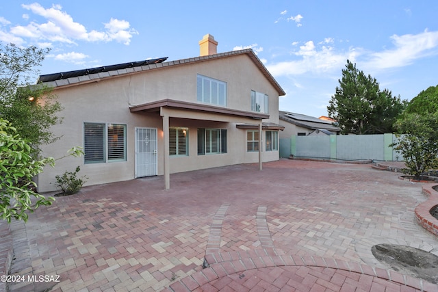 rear view of property with a patio area