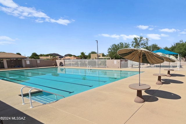 view of swimming pool with a patio area