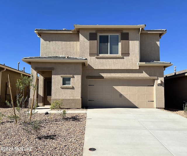 view of front of property with a garage