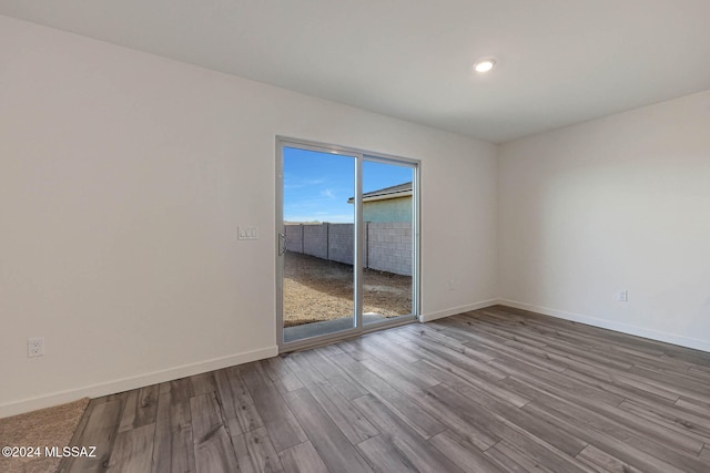 spare room featuring light hardwood / wood-style flooring