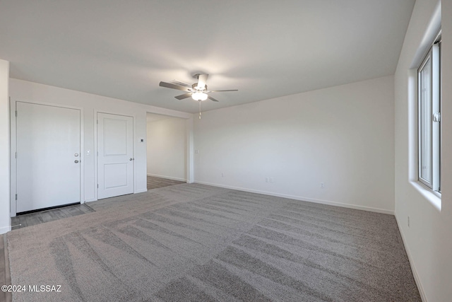 unfurnished bedroom with carpet flooring and ceiling fan