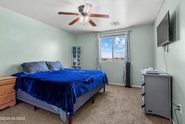 bedroom featuring ceiling fan and light colored carpet