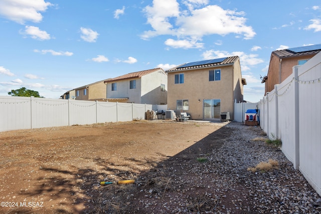 back of property with central air condition unit