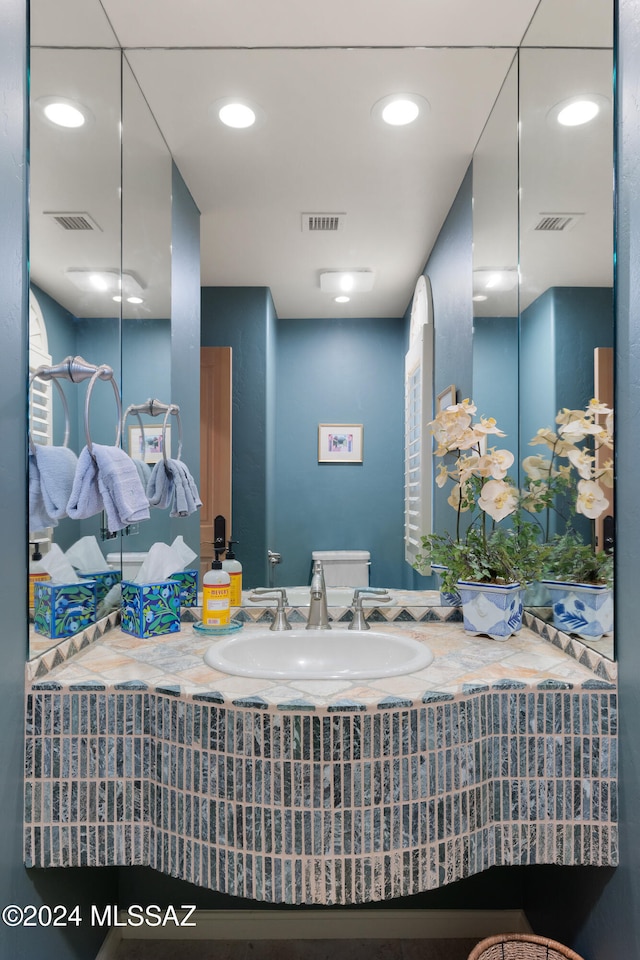 bathroom with toilet and sink