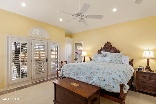 carpeted bedroom with access to outside and ceiling fan