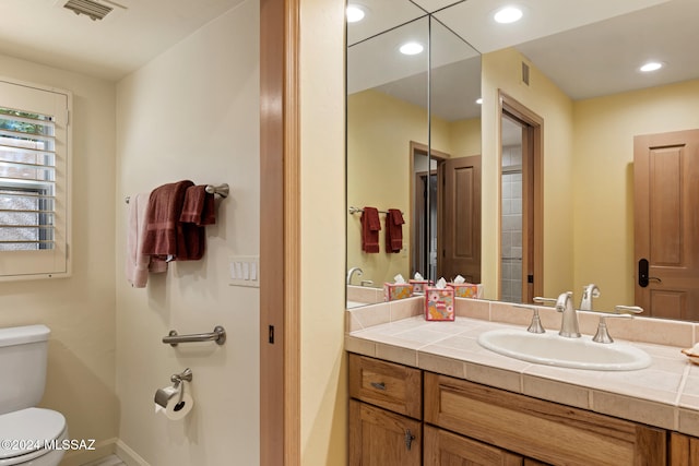 bathroom with vanity and toilet