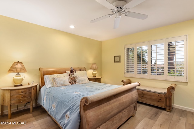 bedroom featuring light wood-type flooring and ceiling fan