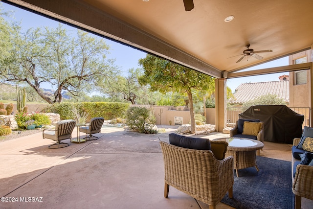 view of patio featuring area for grilling and ceiling fan