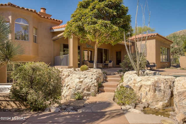 mediterranean / spanish house featuring a patio