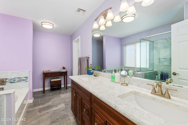 bathroom with vanity and separate shower and tub