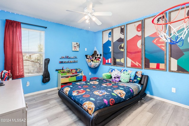 bedroom with light wood-type flooring and ceiling fan