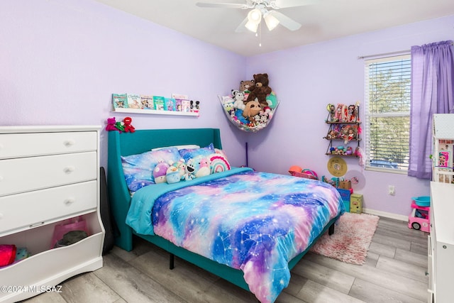 bedroom featuring light hardwood / wood-style flooring and ceiling fan