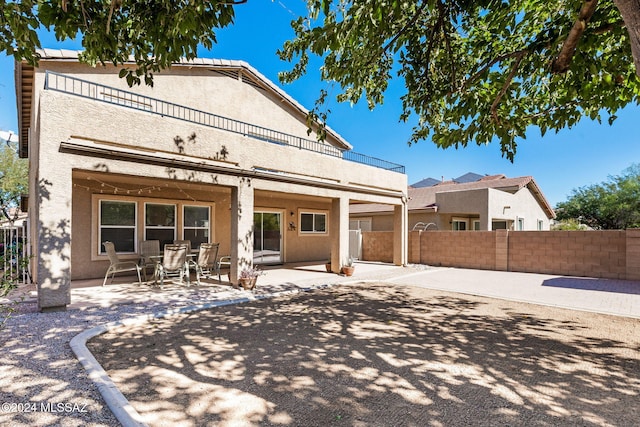 back of house featuring a patio