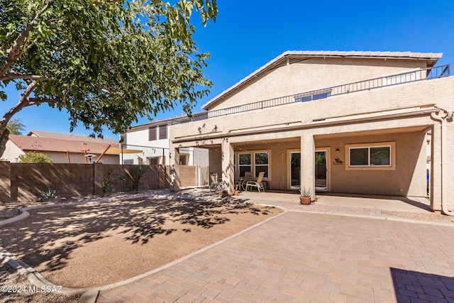 back of house with a patio area