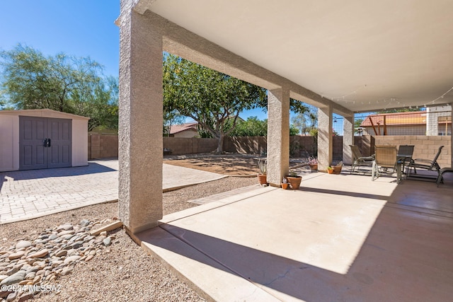 view of patio with a storage shed