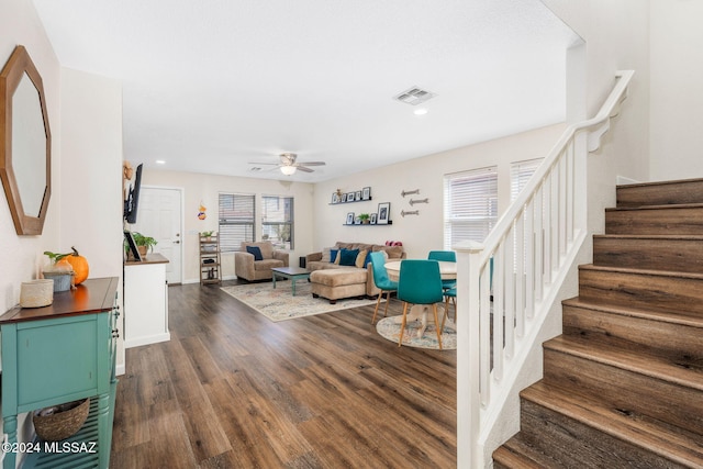 living room with dark hardwood / wood-style floors and ceiling fan