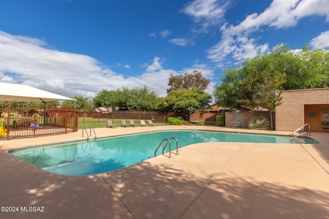 view of pool featuring a patio