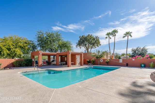 view of swimming pool featuring a patio area