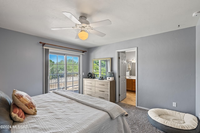 bedroom featuring light carpet, connected bathroom, access to outside, and ceiling fan