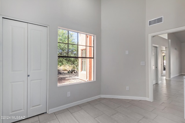 interior space with a closet and multiple windows