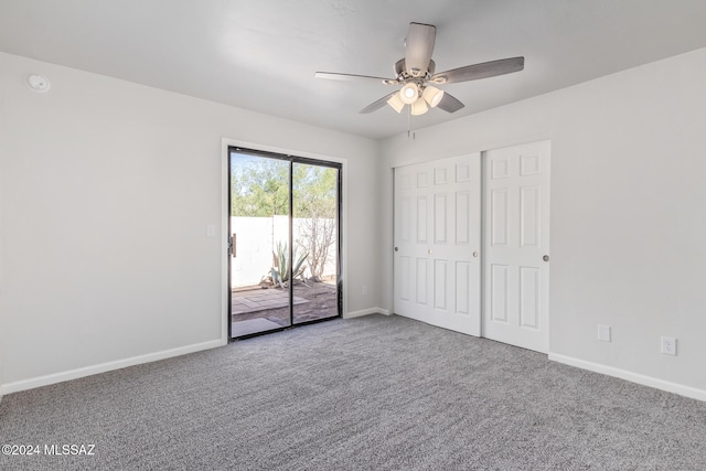 unfurnished bedroom with carpet, access to exterior, a closet, and ceiling fan