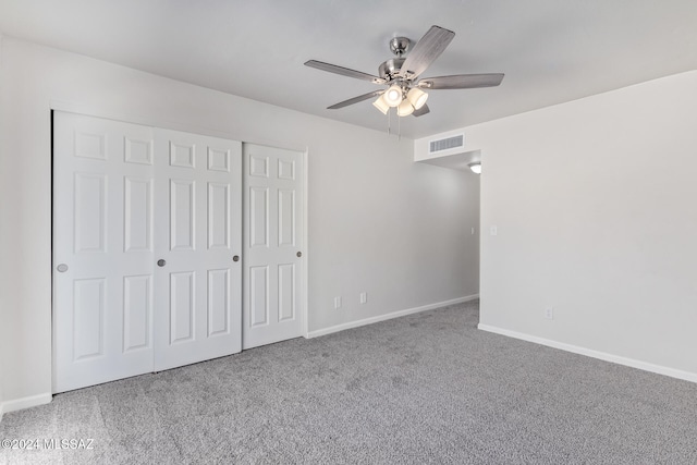 unfurnished bedroom featuring a closet, ceiling fan, and carpet flooring