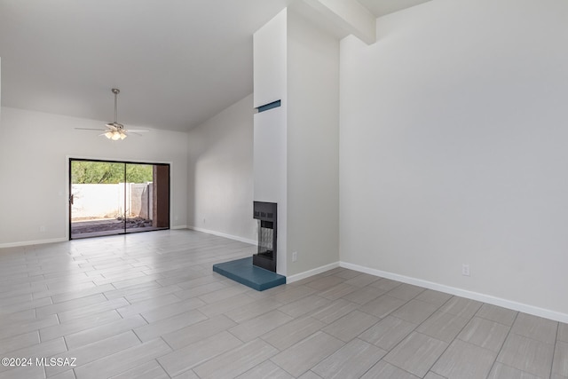 unfurnished living room with ceiling fan, light hardwood / wood-style flooring, and a multi sided fireplace