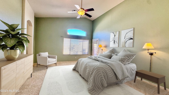 carpeted bedroom featuring ceiling fan and high vaulted ceiling