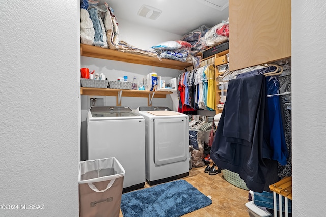 clothes washing area featuring separate washer and dryer