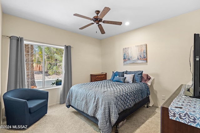 bedroom with light carpet and ceiling fan