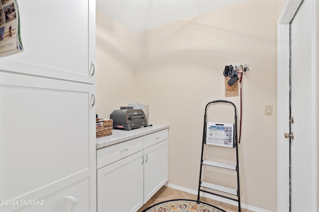 washroom with light tile patterned floors