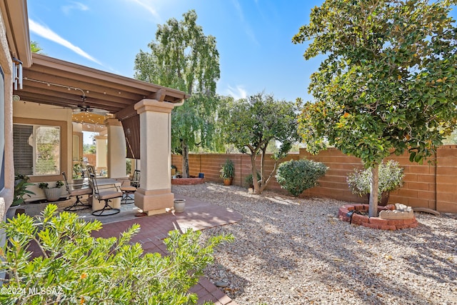 view of patio featuring ceiling fan