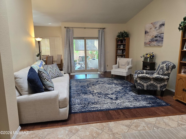 living room with lofted ceiling and light wood-type flooring