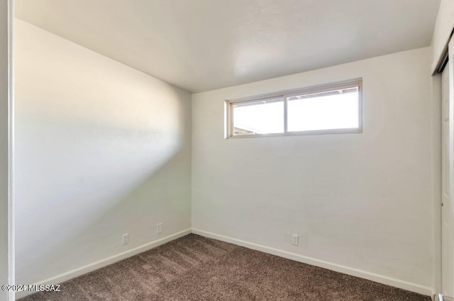 spare room featuring carpet flooring