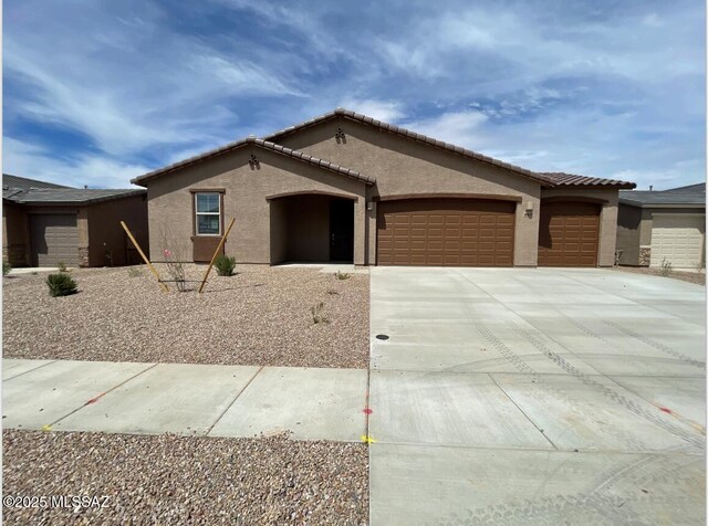 ranch-style house featuring a garage