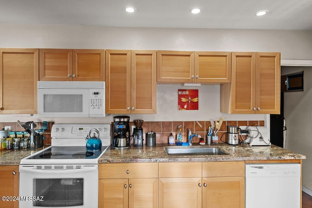 kitchen with white appliances and sink