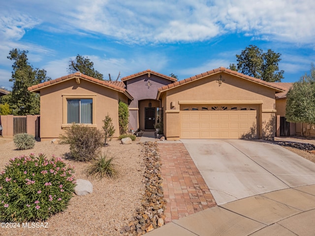 mediterranean / spanish-style house featuring a garage