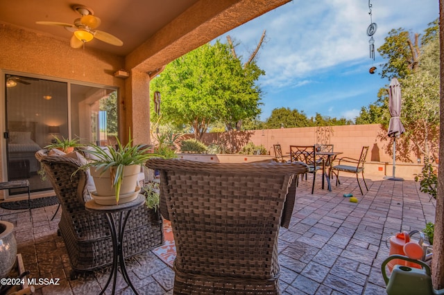 view of patio / terrace featuring ceiling fan