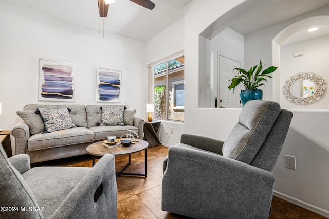 tiled living room featuring ceiling fan