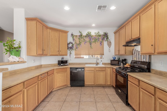 kitchen featuring light brown cabinetry, sink, black appliances, and light tile patterned floors