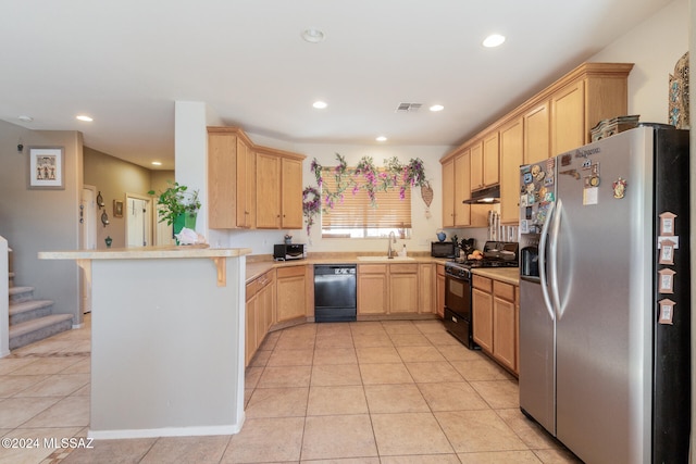 kitchen featuring kitchen peninsula, sink, black appliances, light tile patterned floors, and light brown cabinetry