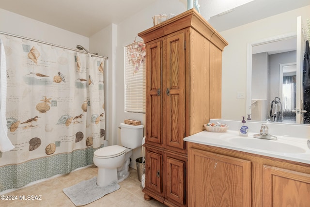 bathroom with vanity, toilet, tile patterned flooring, and a shower with shower curtain