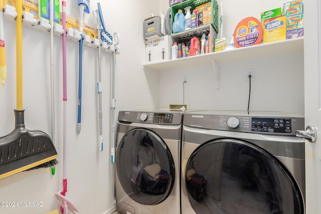 clothes washing area featuring washing machine and dryer