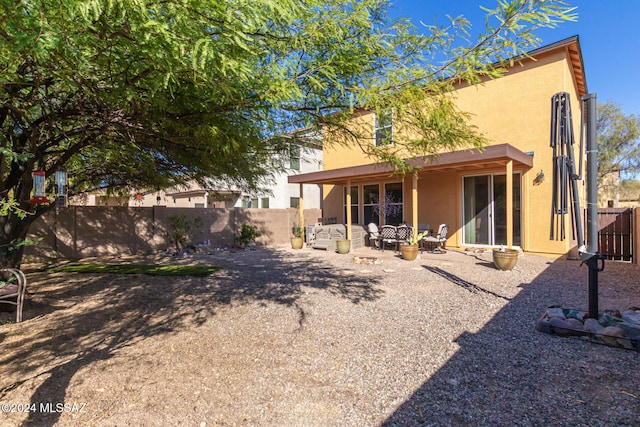 rear view of property with a patio area