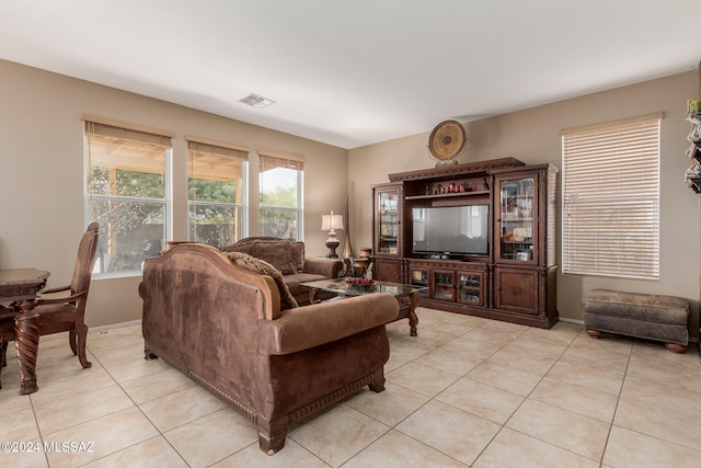 living room with light tile patterned flooring