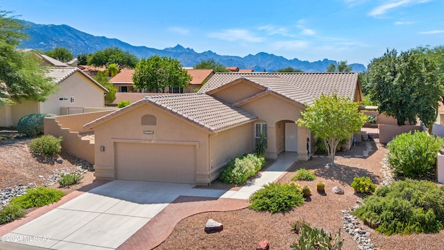 view of front of house featuring a mountain view and a garage