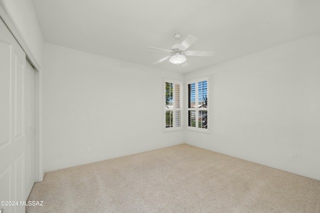 carpeted empty room with ceiling fan