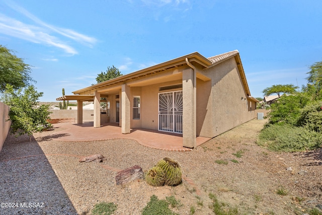 rear view of property with a patio