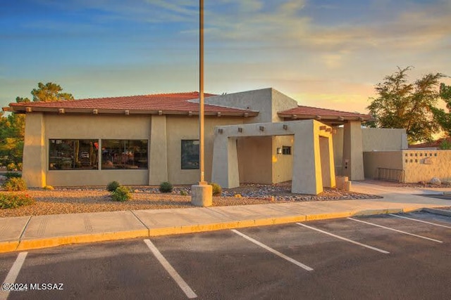 view of outdoor building at dusk