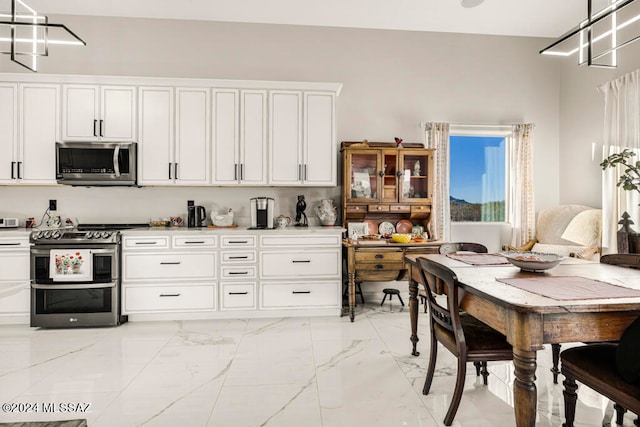 kitchen featuring appliances with stainless steel finishes and white cabinets